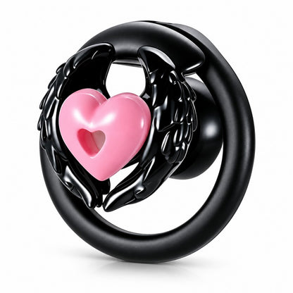Angel wing inverted chastity cage with black feathered wings, a pink heart centerpiece and a black base ring.