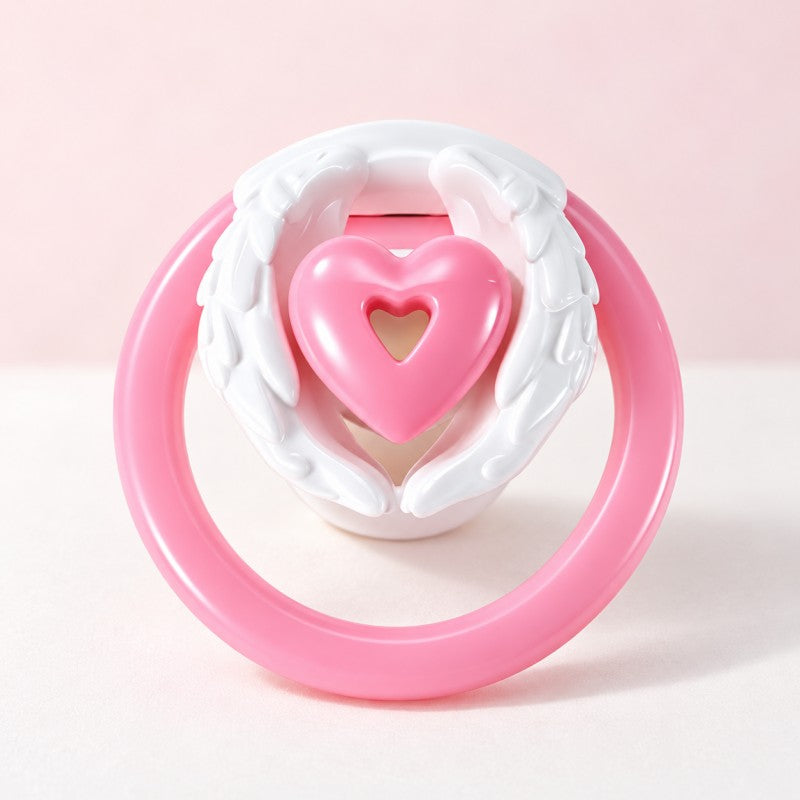White-wing, pink-heart inverted chastity cage with a pink base ring displayed against a pale pink background.