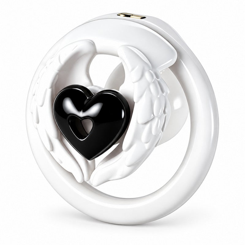 Angel wing inverted chastity cage with white feathered wings, a black heart centerpiece and a white base ring.
