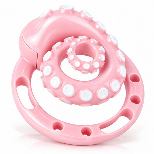 Pink octopus tentacle chastity cage with white suction-cup details and matching base ring, angled front view.